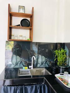 a kitchen with a sink and a counter top at Coco Breeze Villa in Talpe +138 photos