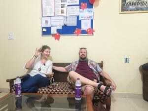a man and a woman sitting on a bench at The Pink Nest - Backpackers Abode in Jaipur +70 photos