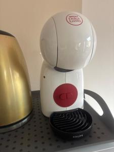 a white blender sitting on top of a counter at L'Ambréenne in Sainte-Cécile