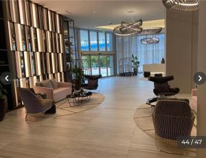 a lobby with chairs and furniture in a building at Hyde house 3507 AL MAR in Hollywood