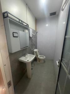 a bathroom with a sink and a toilet at Vientiane Star Hotel in Vientiane +32 photos