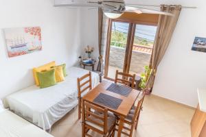 a room with a table and a dining room at Liza's in Lukovë +17 photos