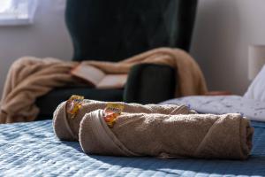 a pair of shoes sitting on top of a bed at LM Apartman in Spišská Nová Ves