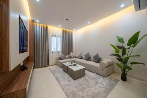 a living room with a couch and a table at اسوار بلس - Aswar Plus in Tabuk