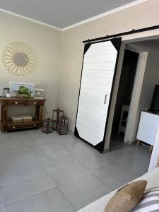a room with a sliding barn door in a bedroom at La quinta de Vito in San Pedro