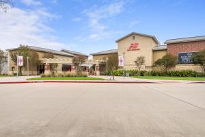 an empty street in front of a store at Holiday Inn Express & Suites - Houston NW - Cypress Grand Pky by IHG in Cypress