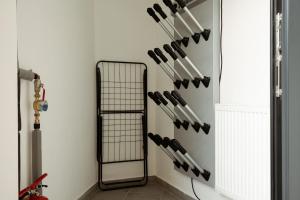 a bunch of baseball bats hanging on a wall at Apartment Horalka - Jasná in Belá