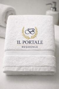 a white towel with the l portaleille residence on it at Il Portale 2 in Tropea
