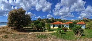 a house on a hill next to the ocean at Villa Voula in Koroni