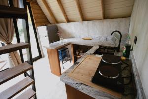 a kitchen with a stove and a counter top at Casa Cayena - Hibiscus House in El Valle +7 photos