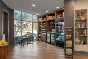 a room with a pharmacy with a counter and shelves at Hotel Indigo Columbus Architectural Center by IHG in Columbus