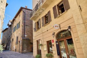a building on a street in a city at Vicolo Nobile in Montepulciano