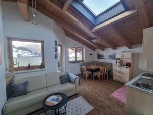 a living room with a couch and a table at Haus Fernblick in Neustift im Stubaital