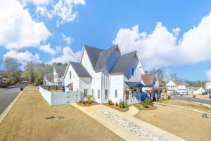 a white house with a black roof at Nova's Nook in Auburn in Auburn