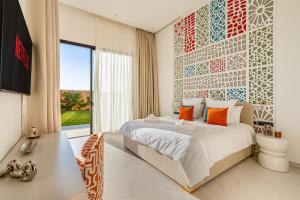 a bedroom with a bed and a wall of tiles at Villa Atlas - Luxe - 4 Suites Modernes - Fitness - Piscine Chauffée - Terrain de Padel - Vue Montagne in Marrakesh