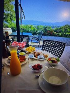 a table with breakfast food on it with a view at agriturismo2laghi in Ponti Sul Mincio
