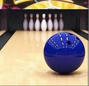 a close up of a bowling alley with a blue ball at EstudioSuite Martinica Wifi Poliforum in Sofía