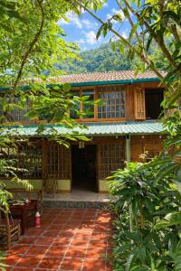 an outside view of a house with a patio at Tả Mẩy Homestay in Lao Cai +61 photos