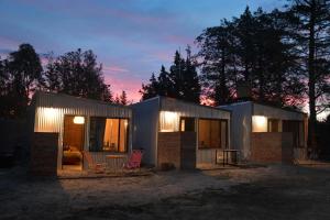 a small house with lights on it at night at Alamos in Puerto Madryn