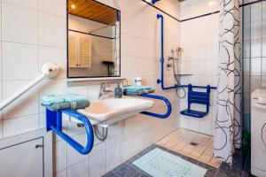 a bathroom with a sink and a mirror at Ferienwohnung Jank in Jenig +47 photos
