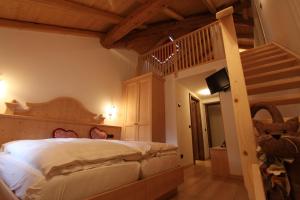 Lova arba lovos apgyvendinimo įstaigoje Hotel Fonte Dei Veli