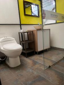 a bathroom with a toilet and a sink at GLAMPING RESERVA CATEDRAL Zipaquira in Zipaquirá +51 photos