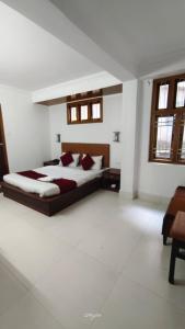 a bedroom with a large bed in a room at Hotel Millilium Inn in Gangtok