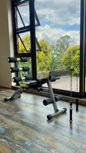 a room with a gym with a large window at Ondjo Yetu in Benoni
