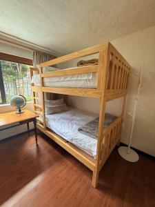 two bunk beds in a room with a table at Hetta's@Delmar in Jeffreys Bay +49 photos