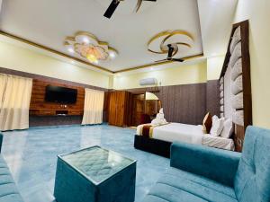 a hotel room with a bed and a tv at Hotel Diamond Crest, Patna in Patna