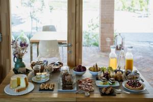 a table with many different types of food on it at Agriturismo Cà Vida in Ziano Piacentino
