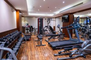 a gym with treadmills and elliptical machines at Vercure Hotel فندق فيركيور جده الحمراء in Jeddah