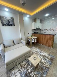 a living room with a couch and a table at VERO Residence in Hurghada