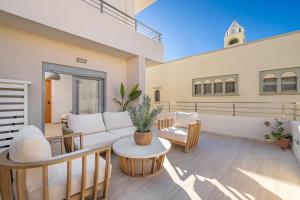 a living room with a couch and a table at Rhodes center Santa Marina in Rhodes Town