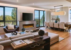 a living room with a couch and a fireplace at Limelight Mammoth in Mammoth Lakes