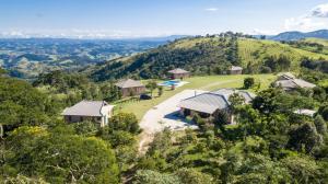 an aerial view of a villa in the hills at Magnificat Cottage in Cunha