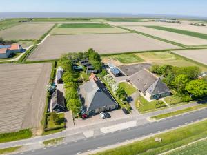 an aerial view of a house and a road at Pension Veldzigt in Wijnaldum