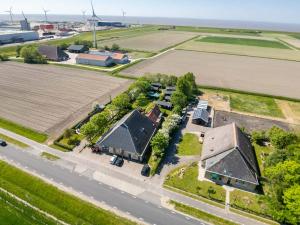 an aerial view of a house and a road at Pension Veldzigt in Wijnaldum