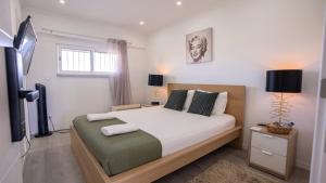 a bedroom with a bed and a television in it at airport room in Lisbon