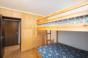 a bedroom with a bunk bed and a bunk bed at Bormio's Balcony - At the Spa in Premadio