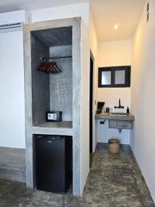a kitchen with a counter and a sink in a room at Casa del Mar Holbox in Holbox Island