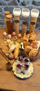 a table topped with a plate of bread and pastries at Monsieur Morgan's in Féniers +14 photos