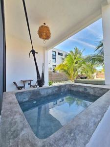 a pool in the backyard of a house at Casa del Mar Holbox in Holbox Island