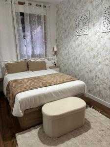 a bedroom with a large bed and a window at Valdefornos in Pontevedra +18 photos