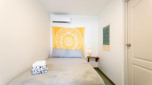 a small bedroom with a bed in a room at GALA Santa Teresa Studios - Walk to Beach & Surf in Santa Teresa Beach