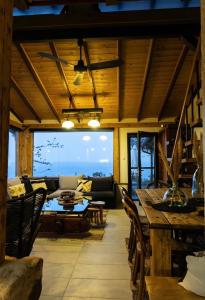 a living room with a couch and a table at Villa Haris in Sarti