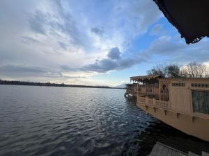 a boat on a large body of water at Cheetah Palace in Srinagar +10 photos