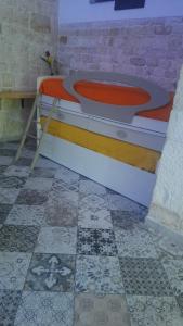 a bath tub in a room with a tile floor at Suite dream room in Turi