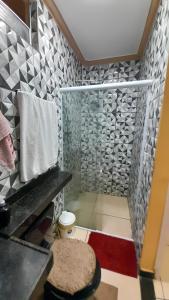 a bathroom with a shower with a toilet in it at Flat Terra do Sol - Jijoca in Jijoca de Jericoacoara