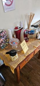 a table with food and other items on it at Pousada Winterhaus in Monte Verde +14 photos